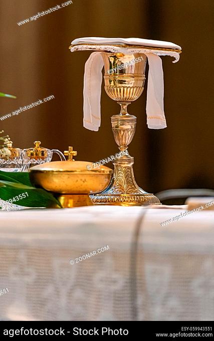 The elevation of the Goblet with the sacramental wine during the Catholic Liturgy of the Eucharist
