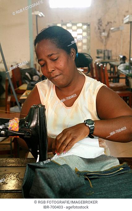 Seamstress working at a small sewing shop in Cienfuegos, Cuba, Caribbean, Americas