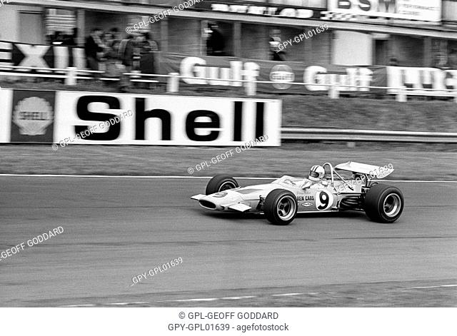 Denny Hulme in a McLaren-Cosworth M14D at Bottom Straight behind pits, finished 3rd. British GP, Brands Hatch, England 18 July 1970