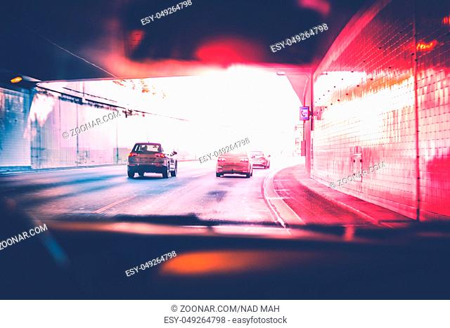 drivers view of cars driving on highway - traffic concept