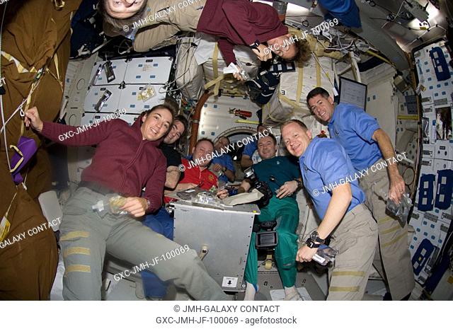 Getting all ten members of an aggregation consisting of seven Endeavour astronauts and three Expedition 18 crewmembers into a single photo wasn't easy as the...
