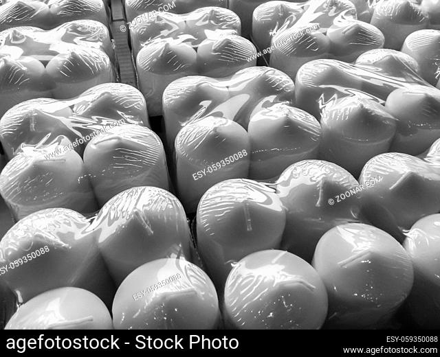 Candles in plastic wrap. Background. Pattern