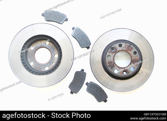 Pair old car brake disc and pads isolated on white background, São Paulo, Brazil