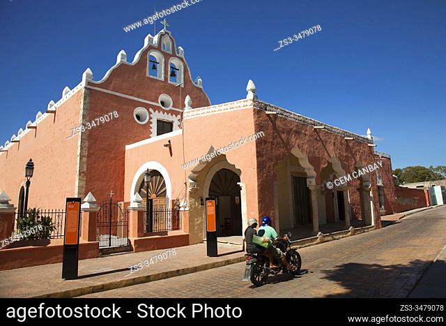Motorcyclist in front of the Our Lady Of Candelaria Church at the town center, Valladolid, Yucatan Province, Mexico, Central America