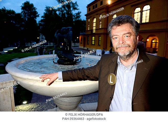Museum director Helmut Friedel (L)poses in the garden during the re-opening ceremony of Lenbachhaus in Munich, Germany, 06 May 2013