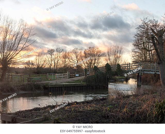 flatford mill river bridge crossing nature sunset autumn winter sky; essex; england; uk
