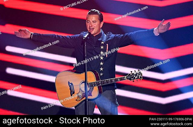 PRODUCTION - 22 October 2022, Saxony, Leipzig: Austrian singer Andreas Gabalier is on stage during the TV show ""Der große Schlagerabschied""