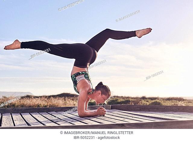 Young woman, yoga, gymnastics on the beach, Cape Town, South Africa, Africa
