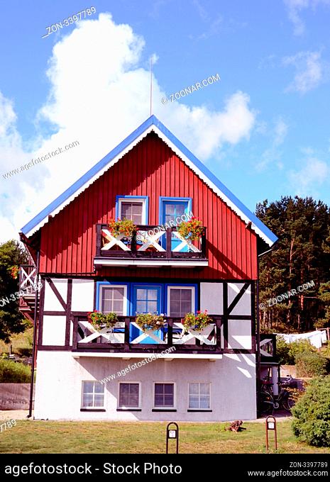 Residential house. Red, blue and white painted walls. Beautiful architectural solution