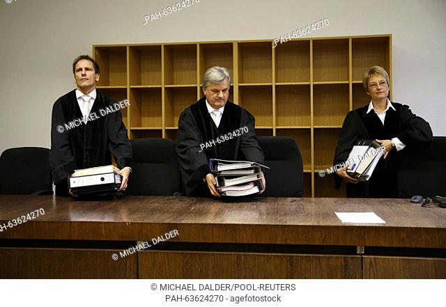 Head Judge Reinhold Baier (C) arrives for the espionage trial against Markus R., a former employee of Germany's foreign intelligence agency (BND) at a courtroom...