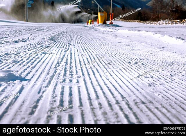 Close-up perspective of freshly groomed ski run slope, Bansko, Bulgaria