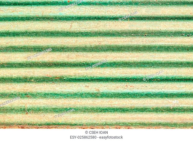 Old rustic painted cracky green wooden texture or background