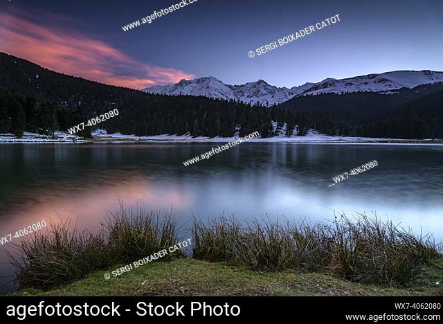 Lac de Payolle lake in a winter sunset (Midi-Pyrénées, Occitania, France)