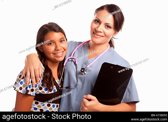 Pretty hispanic girl and female doctor isolated on a white background