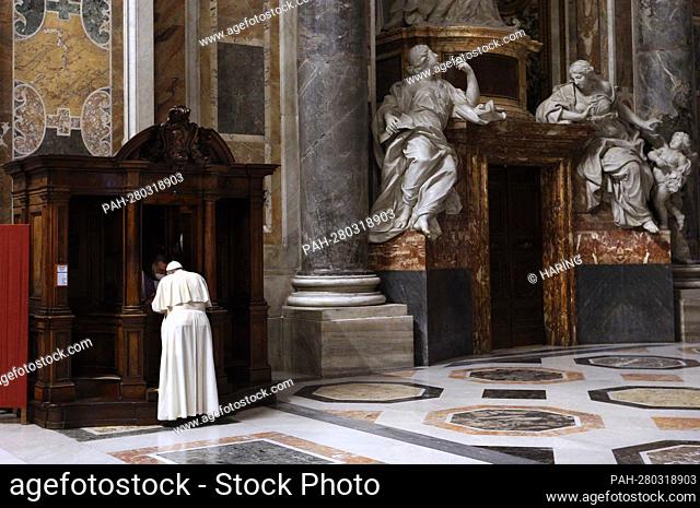 Pope Francis goes to confession during a Lenten penance service in St. Peter's Basilica at the Vatican March 25, 2022. Pope Francis
