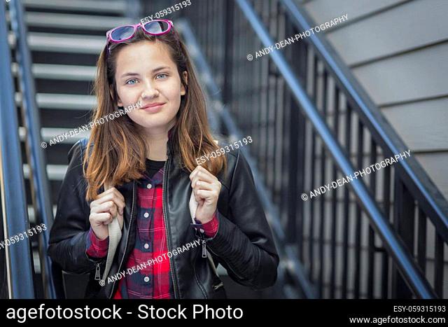 Portrait of Pretty Young Female Student With Backpack on Staircase
