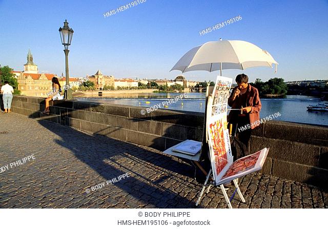 Czech Republic, Prague, historical centre listed as World Heritage by UNESCO, salesman on Charles Bridge over Vltava River