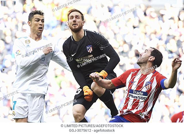 Cristiano Ronaldo (forward; Real Madrid), Filipe Luis (defender; Atletico Madrid), Jan Oblak (goalkeeper; Atletico Madrid) in action during La Liga match...