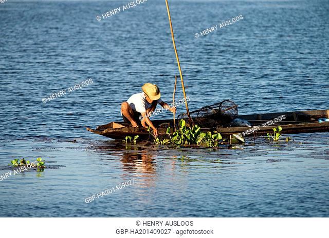 Fisherman in Southern Thailand with fish-traps