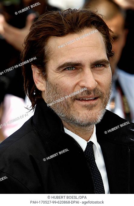 Joaquin Phoenix poses at the photocall of 'You Were Never Really Here' during the 70th Annual Cannes Film Festival at Palais des Festivals in Cannes, France
