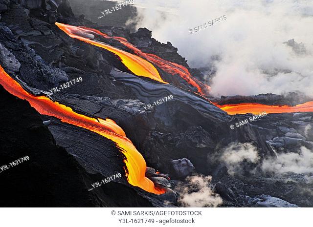 River of molten lava flowing to the sea at sunrise, Kilauea Volcano, Big Island, Hawaii Islands, USA