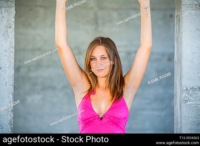 Teenage girl raised arms