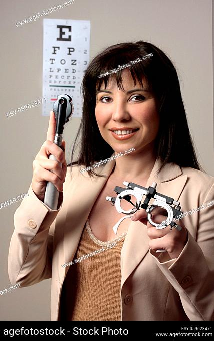 Eye doctor with instruments for checking eyesight