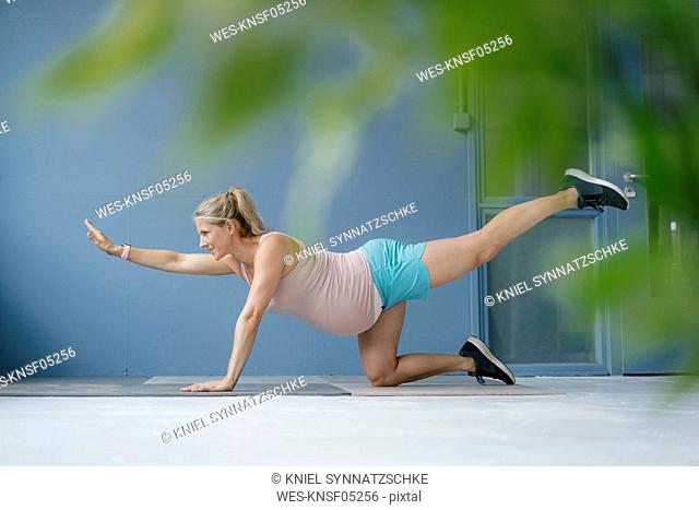 Pregnant woman practicing yoga