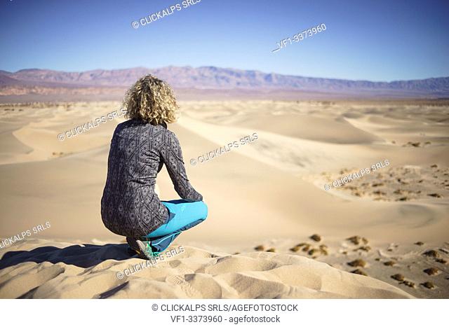 Girl admiring Mesquite Flat Sand Dunes at Death Valley National Park, Inyo County, California, North America, USA