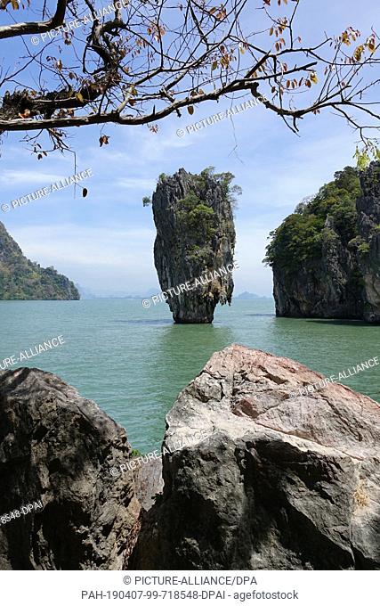 06 March 2019, Thailand, Khao Phing Kan: The striking rock Khao Ta-Pu from the island Khao Phing Kan photographed. The island belongs to the Ao Phang-nga...