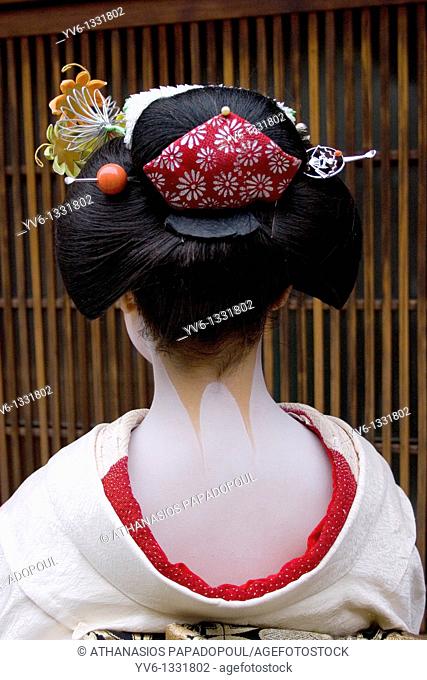 Japan Kyoto Gion area, neighbourhood where Geisha's live and perform Geisha with make up on her neck and shoulders, combed hair, white make up