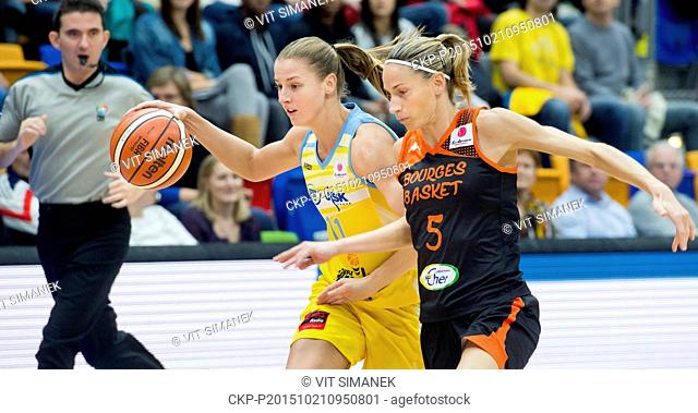 Paoline Salagnac of Bourges, right, and Katerina Elhotova of USK, left, fight for a ball during the women's basketball Euroleague, Group B