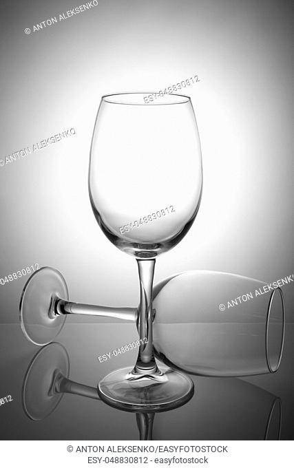 Two empty wine glasses isolated on white background