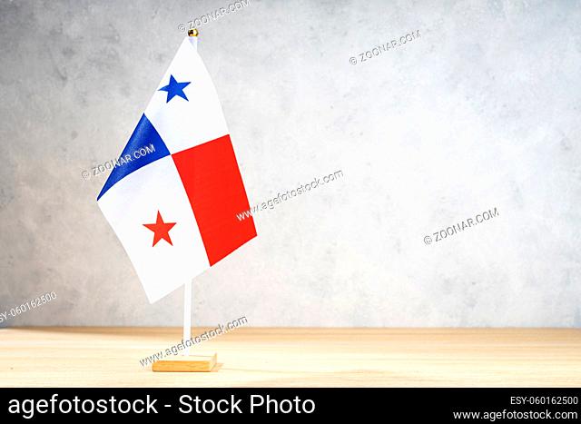 Panama table flag on white textured wall. Copy space for text, designs or drawings