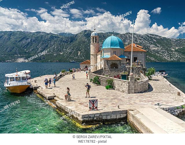 Perast, Montenegro - 07. 11. 2018. Our Lady of the Rocks church on an Island in the Bay of Kotor, Montenegro, in a sunny summer day