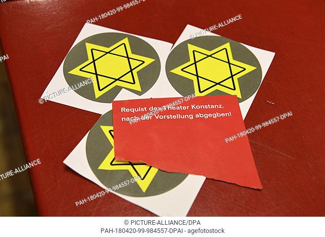 20 April 2018, Germany, Konstanz: Three Star of David stickers on a counter in the foyer after the premiere of the play ""Mein Kampf"" by George Tabori