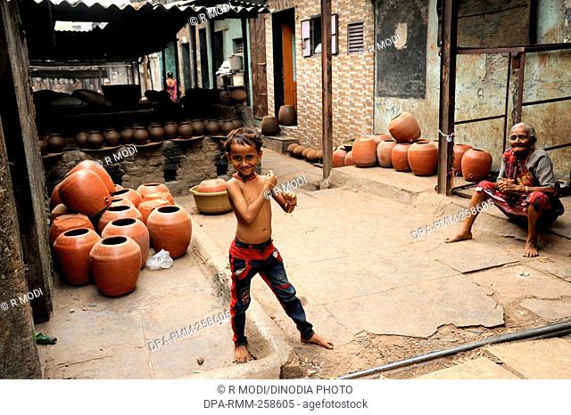 child playing dharavi slum, mumbai, maharashtra, India, Asia
