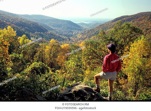 Georgia, GA, Woman standing at overlook at Walasi-Yi Visitor Center at Neel's Gap looking at mountains in the Chattahoochee National Forest in the fall in...