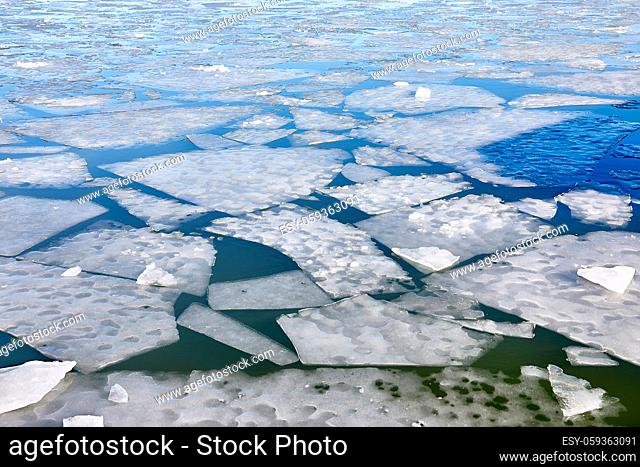 Ice sheets on a frozen water body