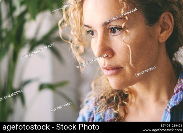 Portrait of young adult caucasian woman looking worried in front of her. Female people problems concept lifestyle. Middle age attractive lady with serious...