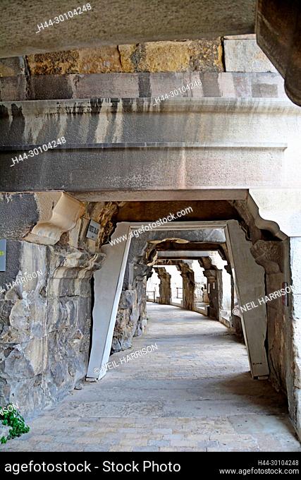 Internal corridor of an Ancient Roman Amphitheatre at Nimes in the South of France with steps leading to the seats and the exits