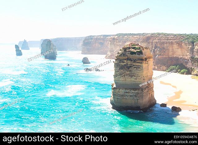 Cliffs and Twelve Apostels, beach with backlight the Great Ocean Road, Victoria, Australia