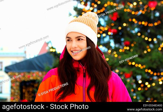 happy teenage girl over christmas market