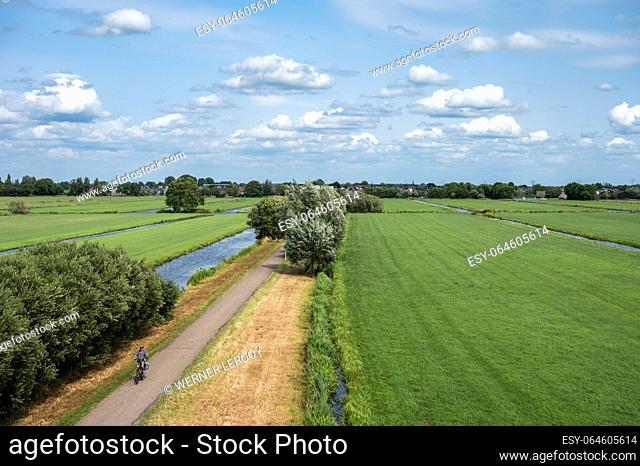 Reeuwijk, South Holland, The Netherlands, July 9, 2023 - Green lawns and canals at the natural flood zones of the Reeuwijkse Plassen
