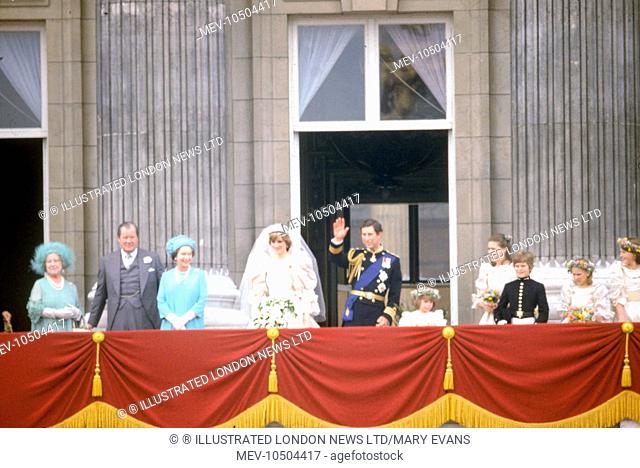The newly married Prince and Princess of Wales appear together on the balcony of Buckingham Palace to wave to the waiting crowds below following their wedding...