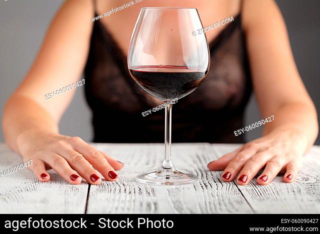 Young girl with glass of wine