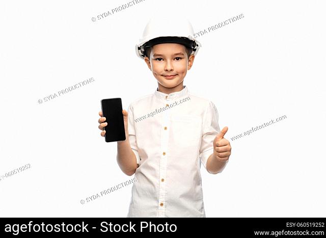 little boy in construction helmet with smartphone