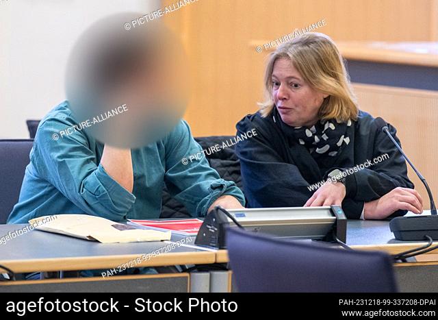 18 December 2023, Bavaria, Regensburg: The defendant sits next to his defense lawyer Stephanie Bauer in the courtroom of the district court