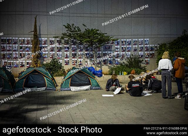 16 December 2023, Israel, Tel Aviv: Israelis and family member of the hostage families protest and build tents outside Kiriya military base calling on Prime...