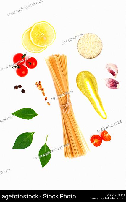 Set of ingredients for cooking spaghetti with Pesto sauce and tomatoes on a white background